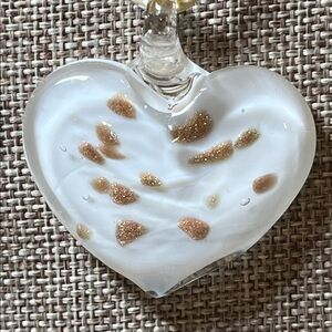 Glass heart pendant with gold flecks on cream cord necklace
